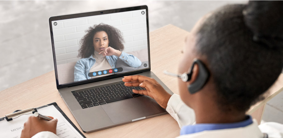 doctor talking to client on the laptop